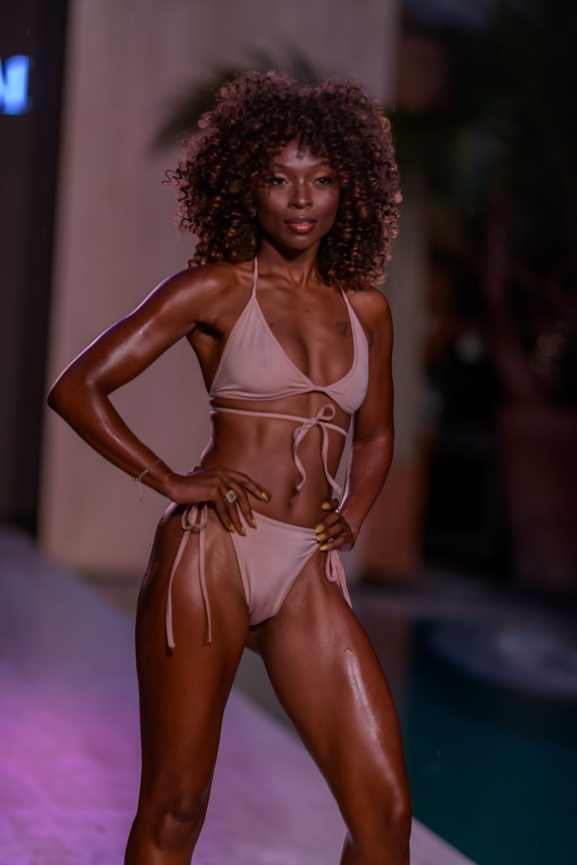 Runway model in a blush pink swimsuit at Miami Swim Week