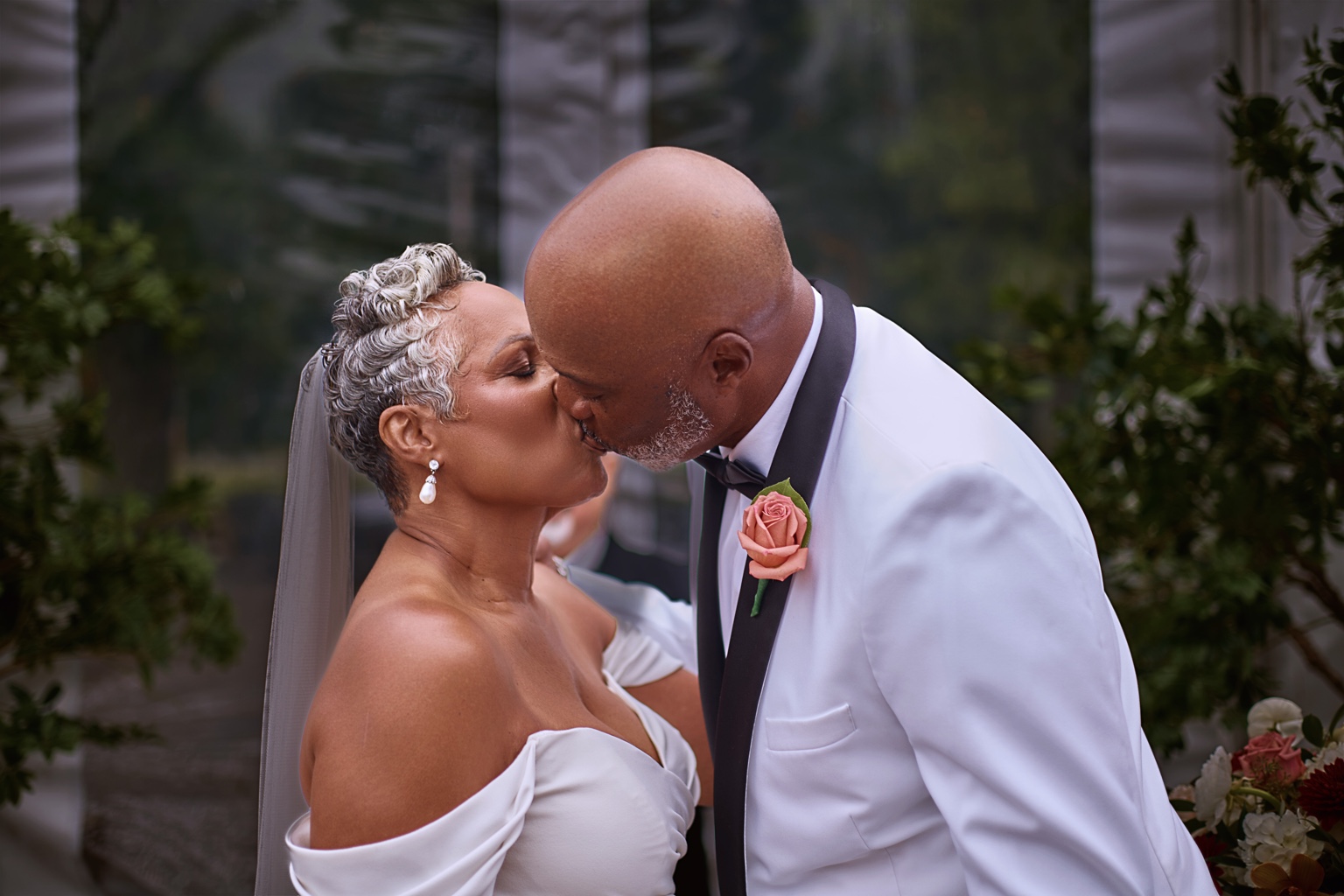 Newlyweds sharing a kiss during their wedding celebration