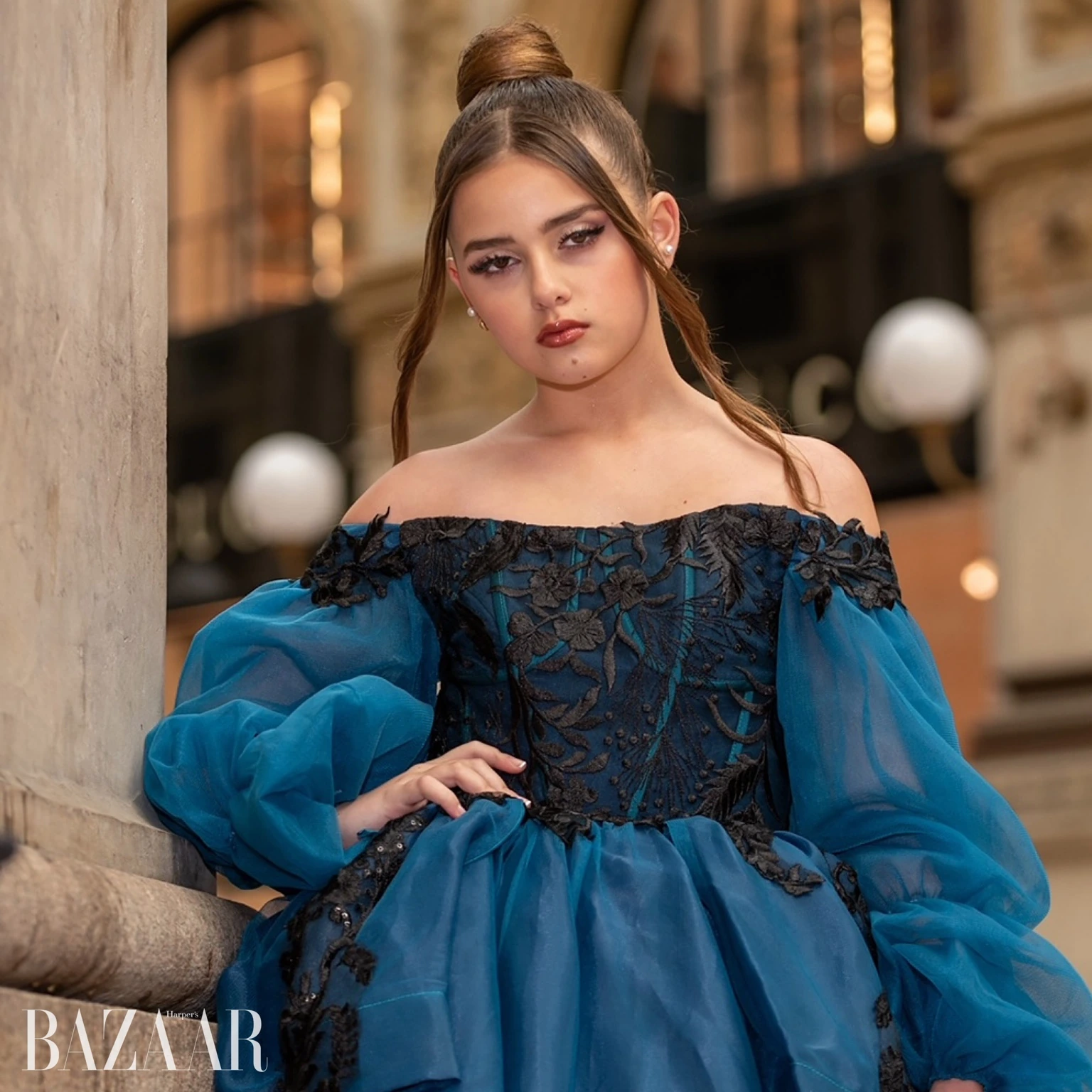Editorial portrait in a blue evening gown with magazine cover lettering